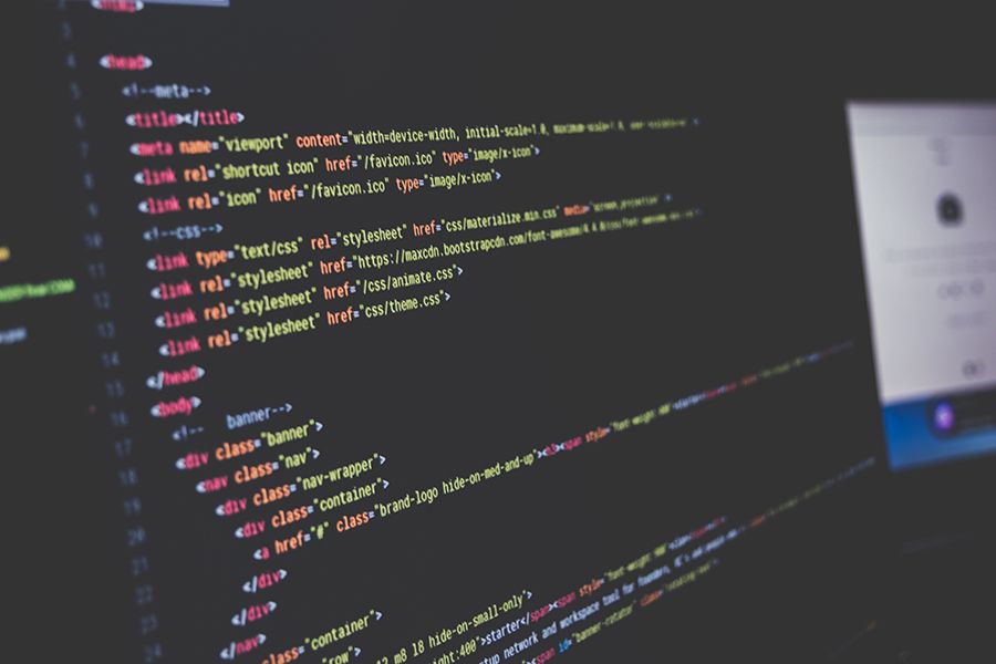 HTML code on a monitor illustrating affiliate tracking scripts and postbacks